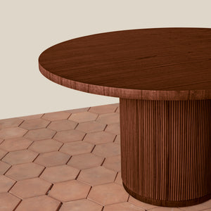 Wooden round table on a hexagonal patterned floor with a neutral background - Number 3
