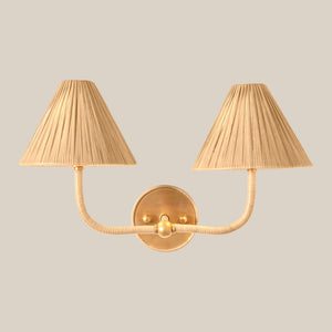 Gold wall sconce with two pleated lampshades on a beige background - Number 2