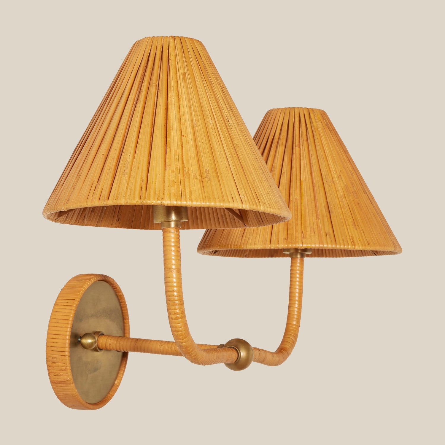 Wall-mounted lamp with pleated rattan shades on a beige background- Number 3
