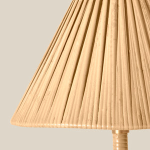 Close-up of a pleated beige lampshade on a neutral background - Number 4