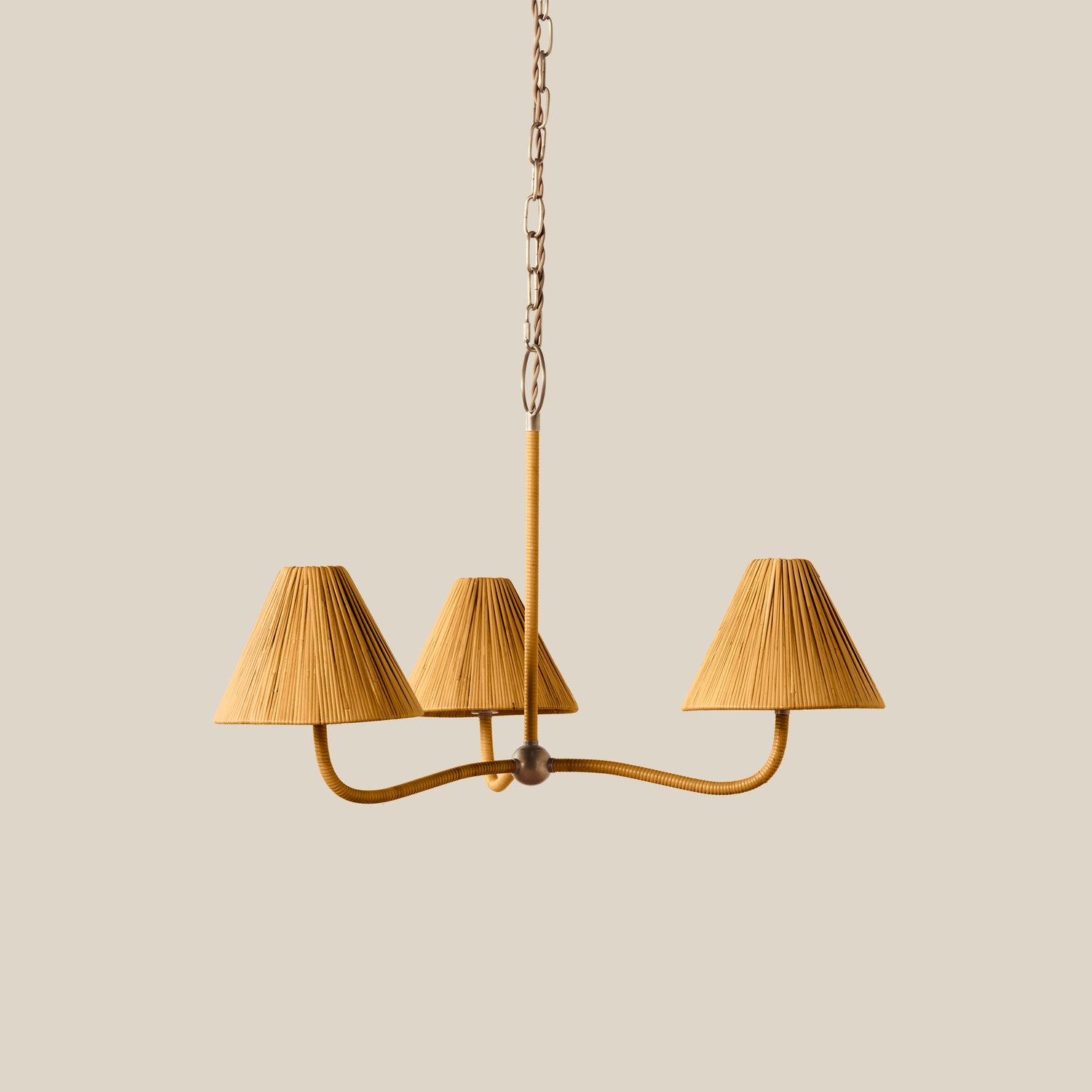 Brown chandelier with three lampshades on a beige background- Number 1