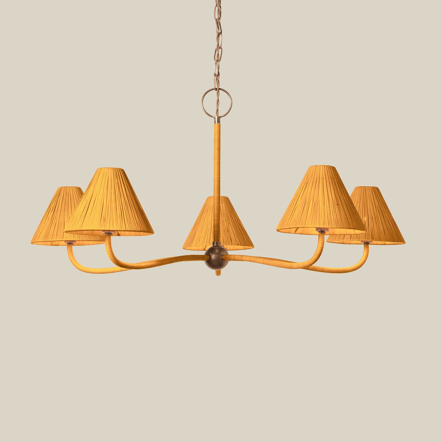 Rattan chandelier with five lampshades on a beige background- Number 2