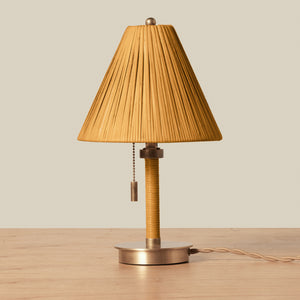 Table lamp with pleated brown shade on a wooden surface - Number 1