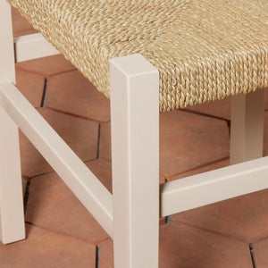 Chair with woven seat and white frame on a wooden floor - Number 20