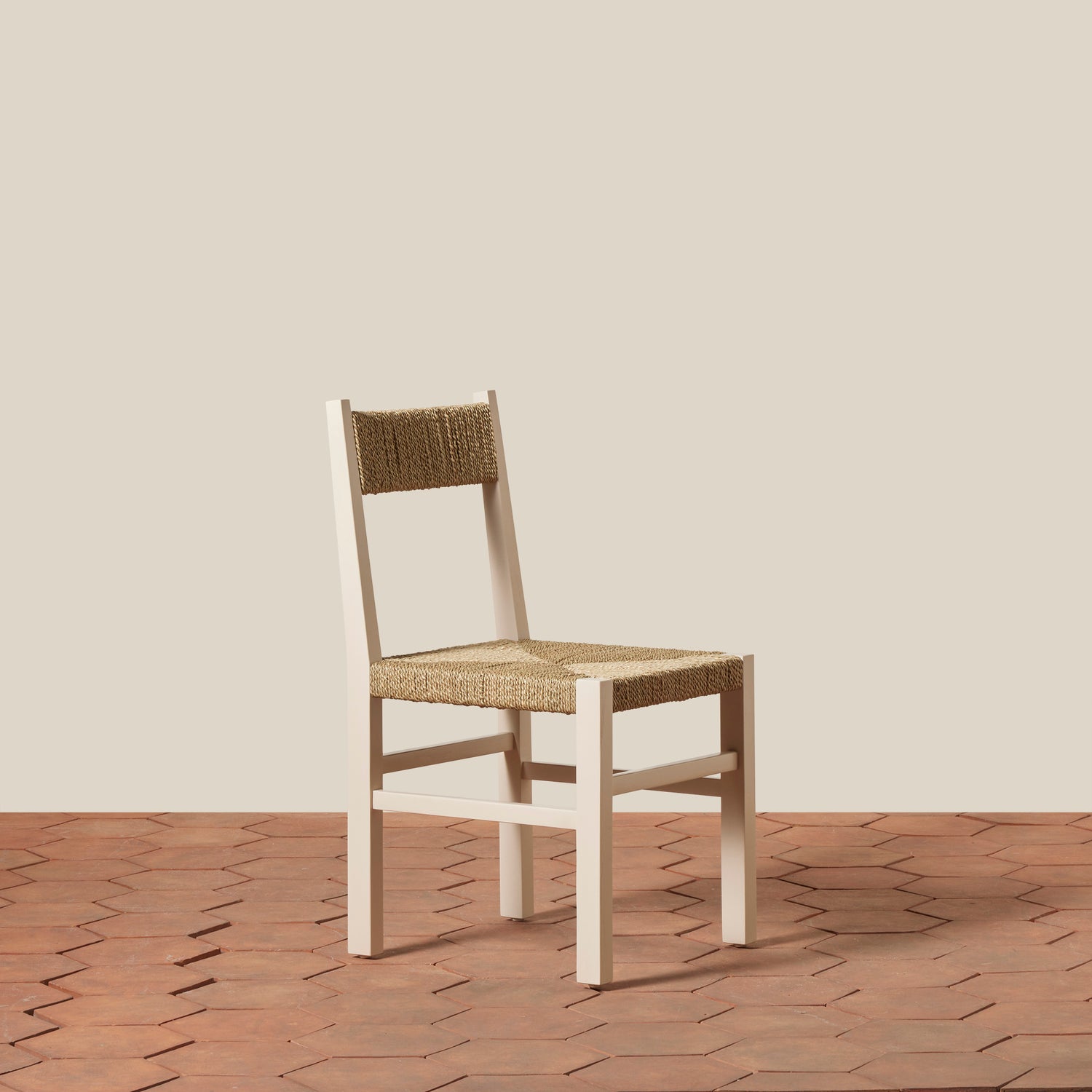 Wooden chair with woven seat and backrest on a wooden floor.- Number 15