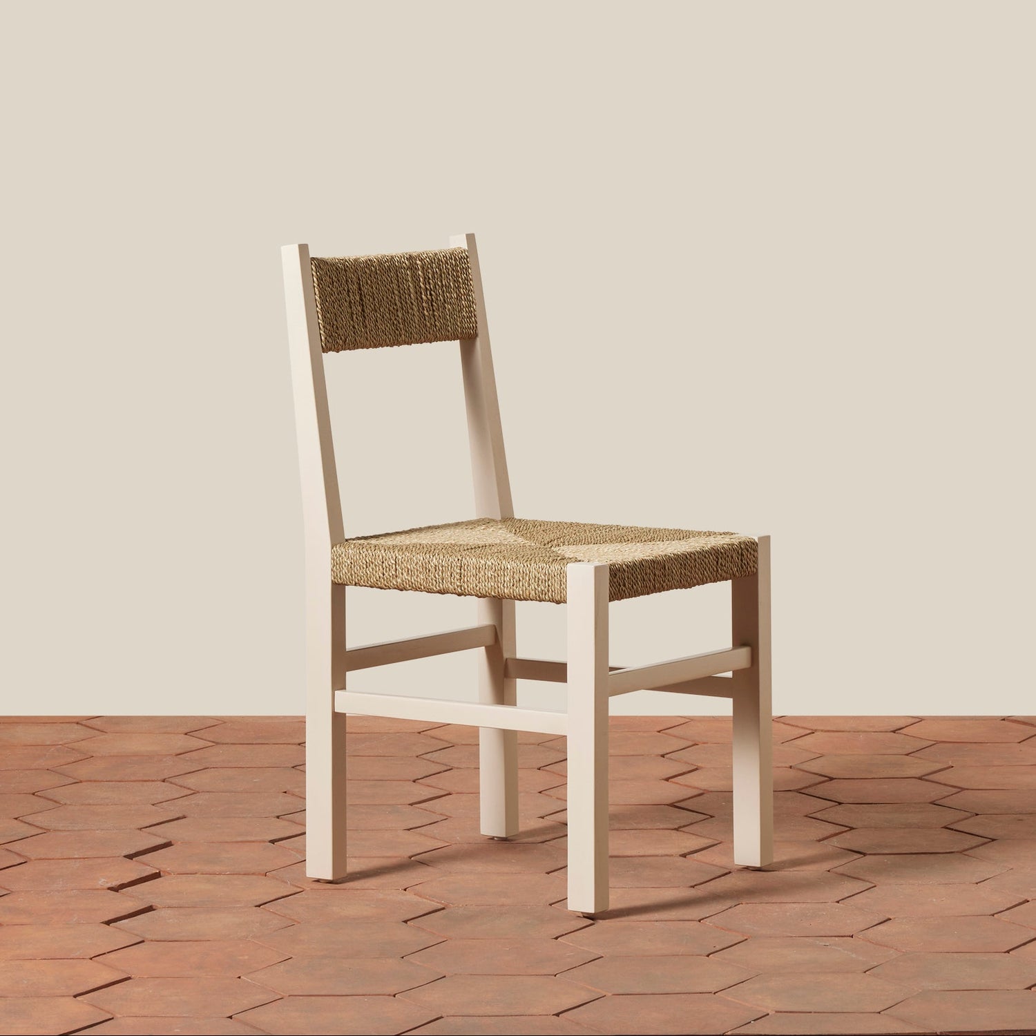 Wooden chair with woven seat and backrest on a wooden floor.- Number 9