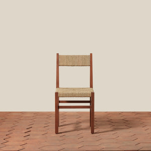 Wooden chair with woven seat and backrest on a wooden floor and beige wall background - Number 11