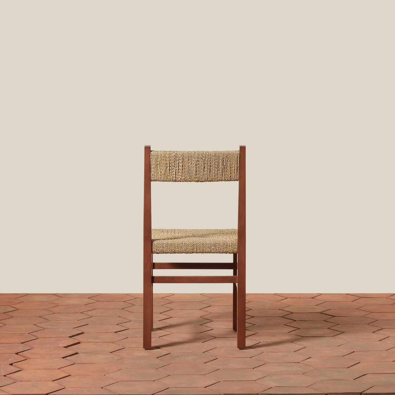 Wooden chair with woven seat and backrest on a wooden floor.- Number 12