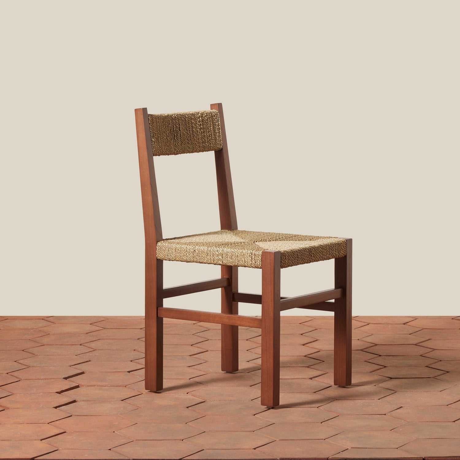 Wooden chair with woven seat and backrest on a wooden floor.- Number 21