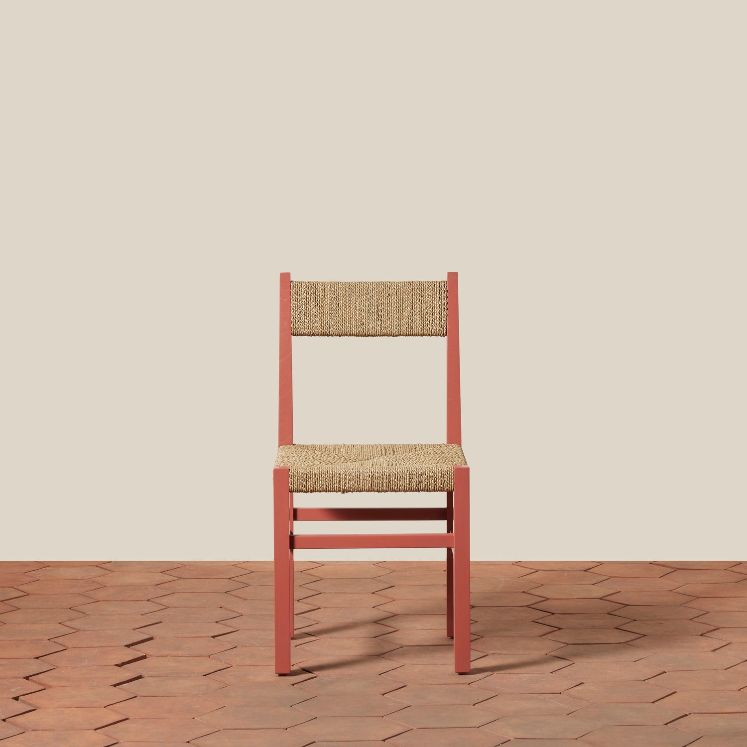 Chair with woven backrest and seat on a wooden floor with beige wall background- Number 5