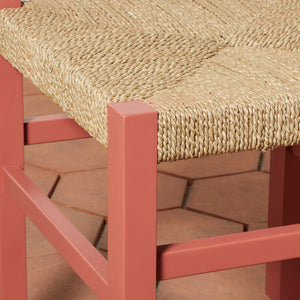 Chair with woven seat and red frame on a wooden floor - Number 8
