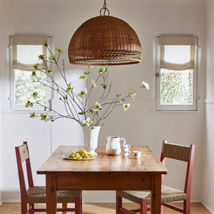 Dining room with wooden table, chairs, and decorative elements. - Number 2