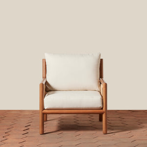 Wooden armchair with white cushions on a wooden floor and beige wall background - Number 9