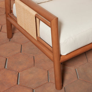 Wooden chair with beige cushion on a hexagonal tile floor - Number 12
