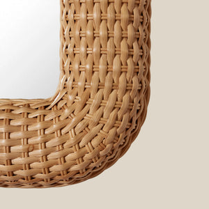 Close-up of a woven rattan mirror on a plain background - Number 3