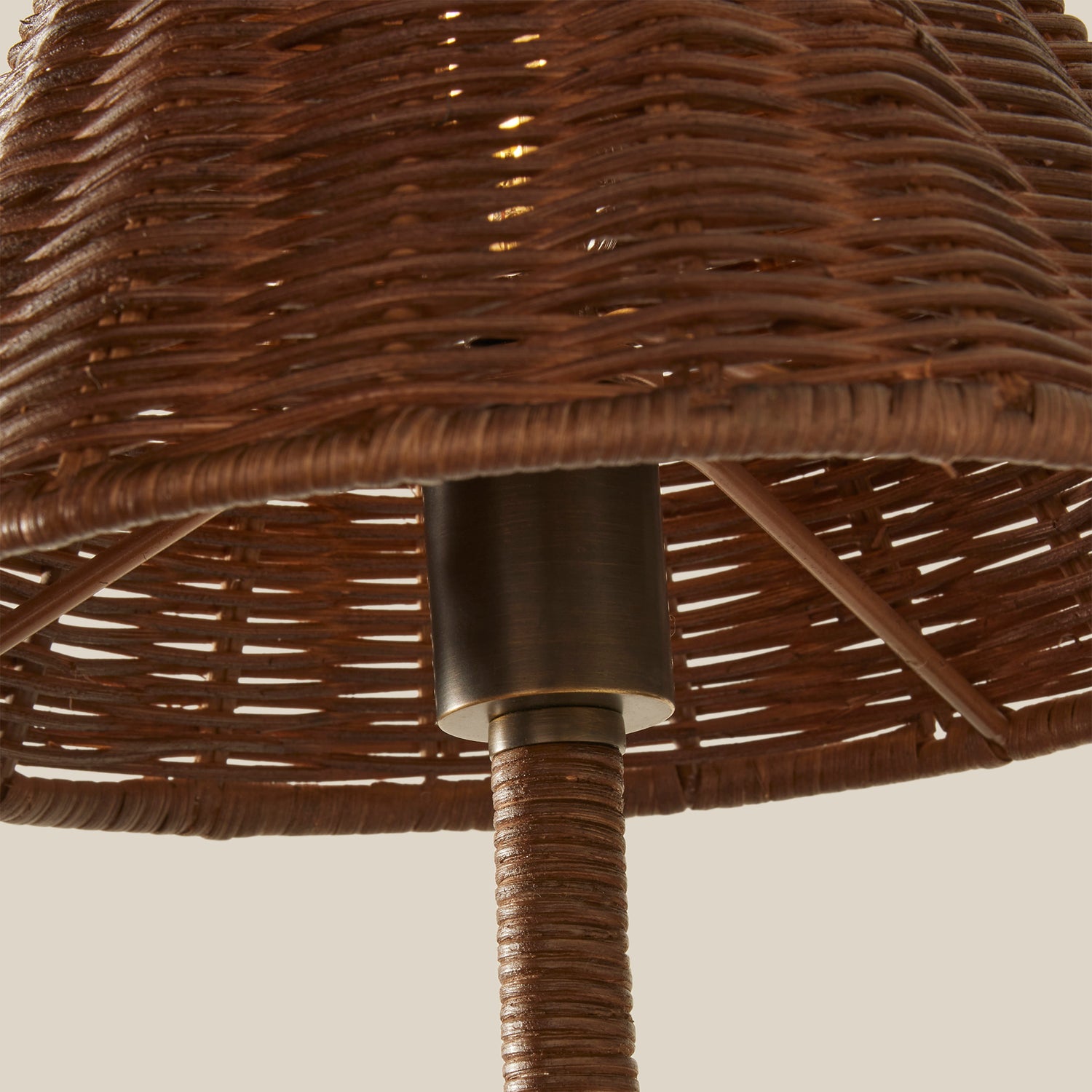 Close-up of a wicker chair with a metal base on a plain background- Number 4