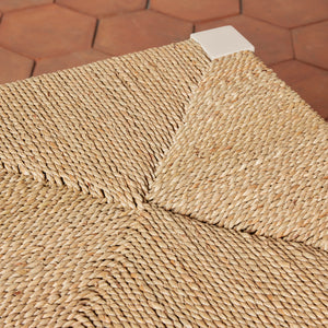 Close-up of a woven mat on a hexagonal tile floor - Number 11
