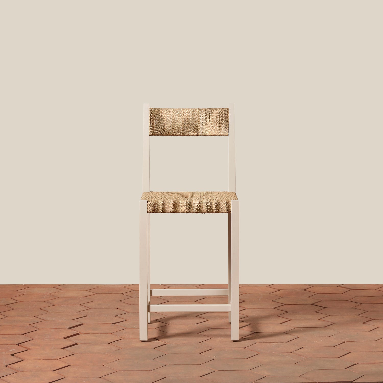 Wooden chair with woven seat and backrest on a wooden floor and beige wall- Number 15