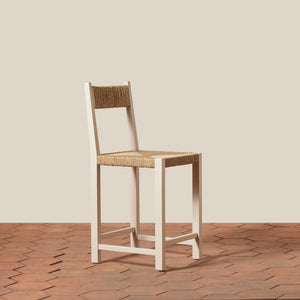 Bar stool with woven seat and backrest on a wooden floor. - Number 13