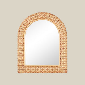 Decorative mirror with an arch-shaped, woven frame on a beige background - Number 1
