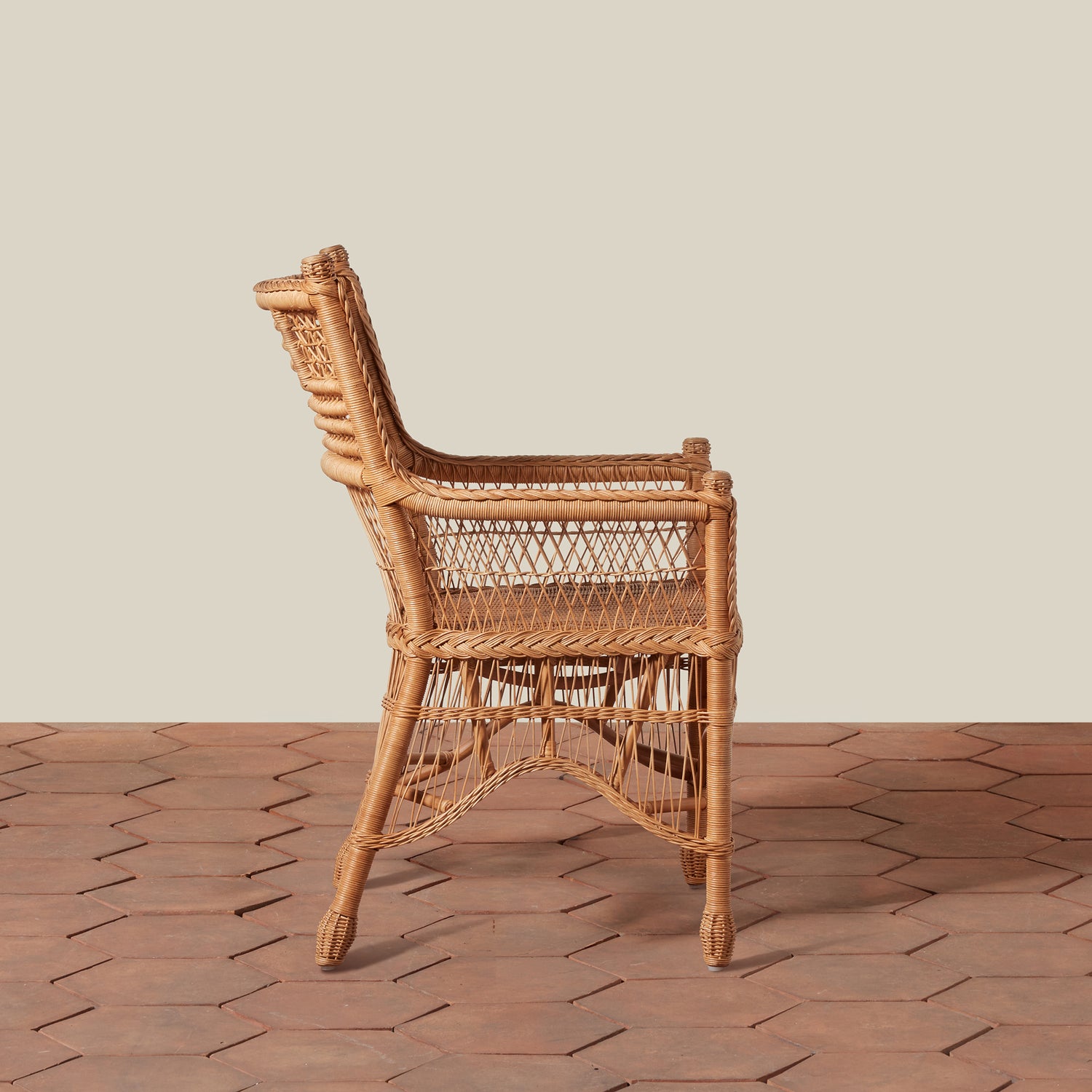 Wicker chair on a wooden floor with a neutral background- Number 2