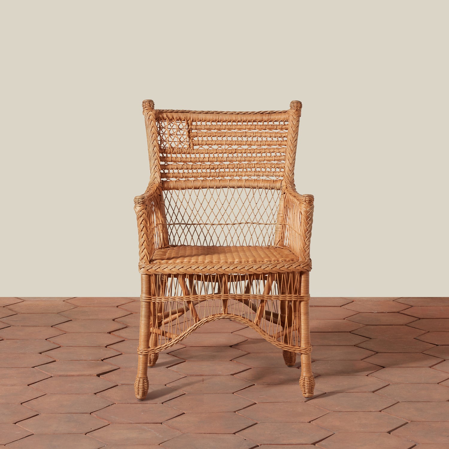 Wicker chair on a stone floor with a neutral background- Number 3