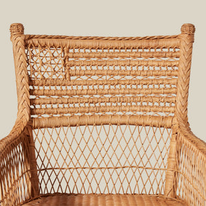 Woven wicker chair with intricate patterns on a neutral background - Number 5