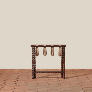 Wooden stand with three hanging straps on a beige background - Number 3