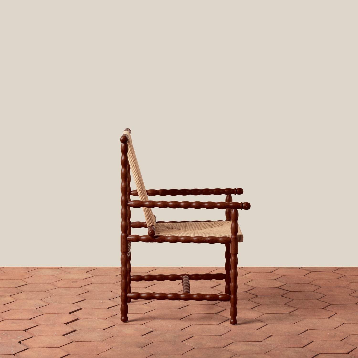 Wooden chair with a woven backrest on a wooden floor against a beige wall- Number 5