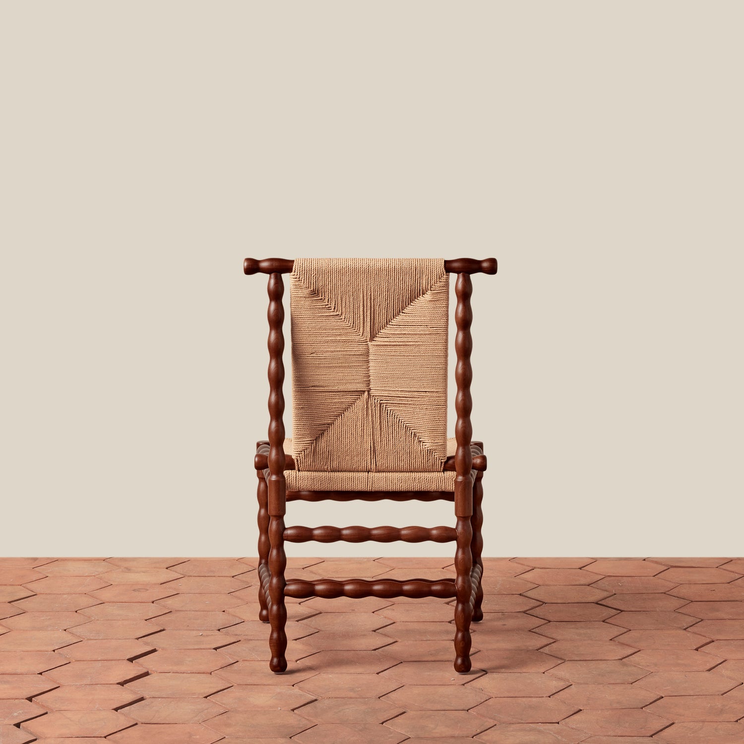 Wooden chair with woven backrest on a wooden floor and beige wall- Number 5