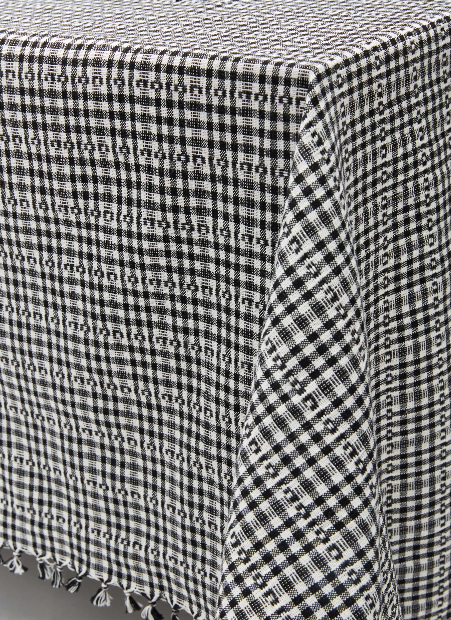 black and white tablecloth on corner of table- Number 6