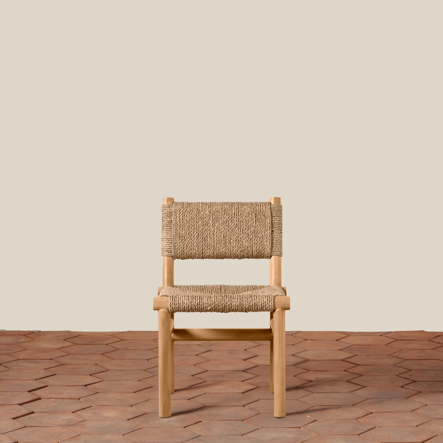 Wooden chair with woven backrest on a wooden floor and beige wall background- Number 5