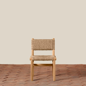 Wooden chair with woven backrest on a wooden floor and beige wall background - Number 5
