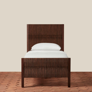 Wooden bed frame with white mattress and pillow on a beige background - Number 9