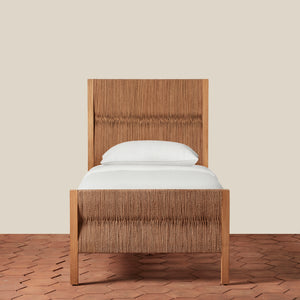 Wooden bed with white mattress and pillow on a beige background - Number 3