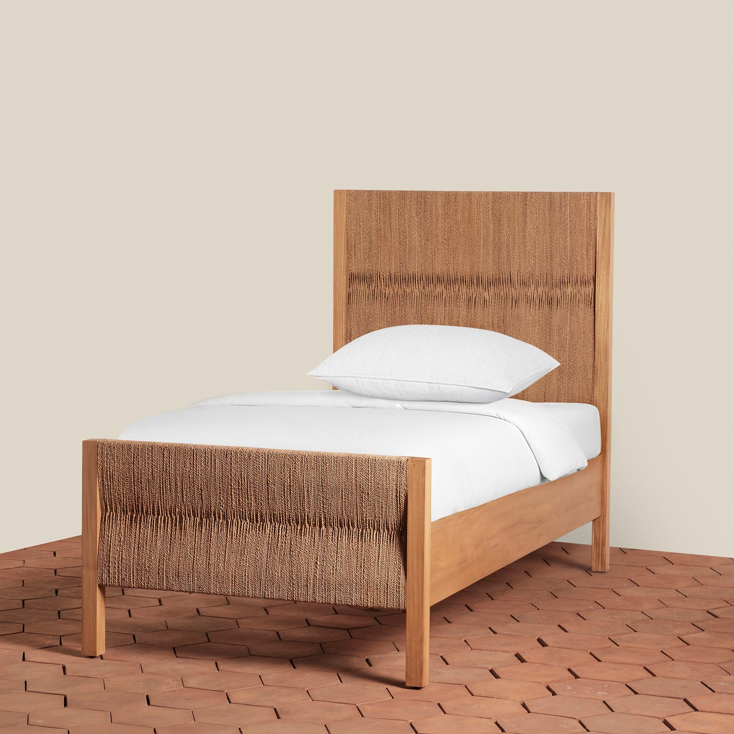 Wooden bed with white bedding on a wooden floor and beige wall background- Number 1