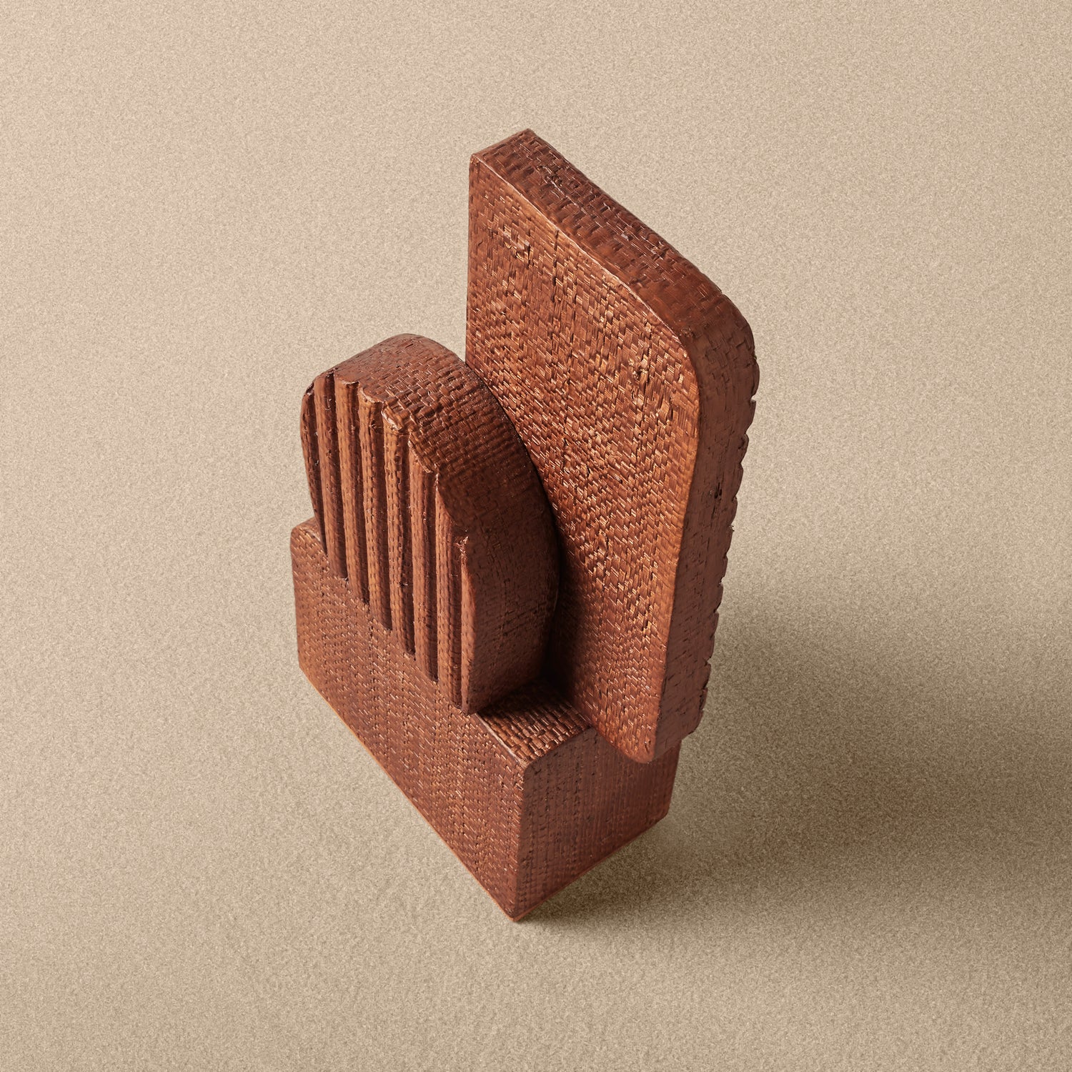 Brown textured block on a beige background- Number 3