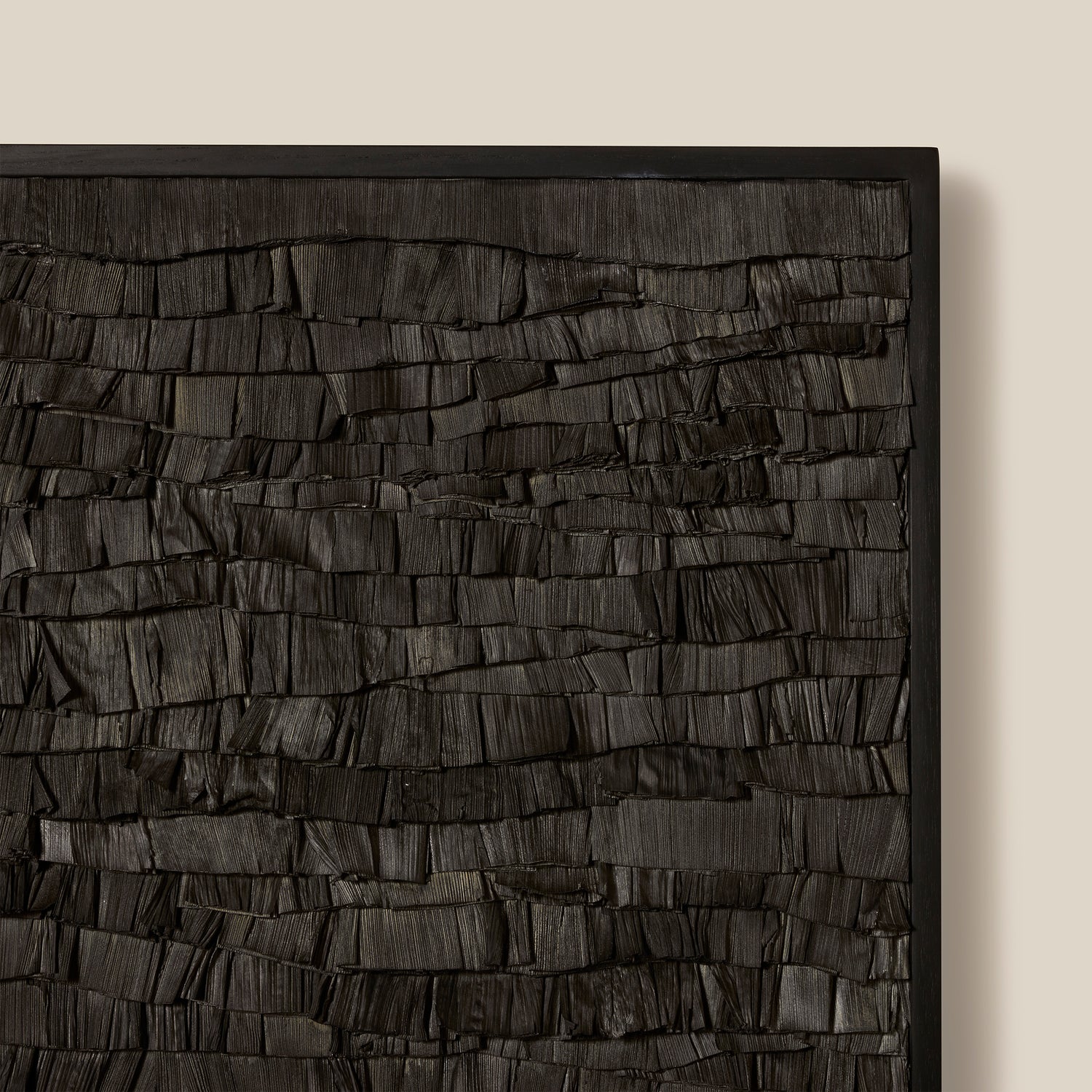Textured black wall art piece on a beige background- Number 3