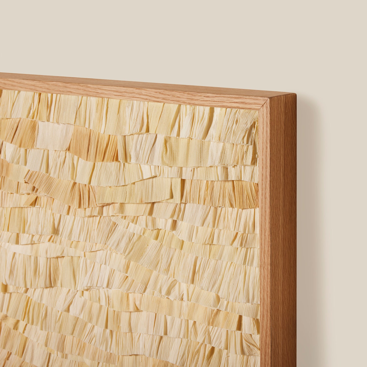 Wooden frame with a textured, mosaic-like pattern on a beige background- Number 5