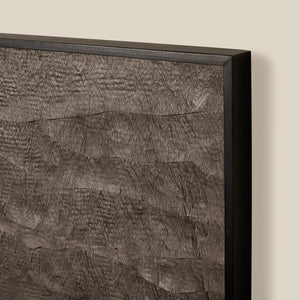 Close-up of a textured wall panel with a black frame on a beige background - Number 3