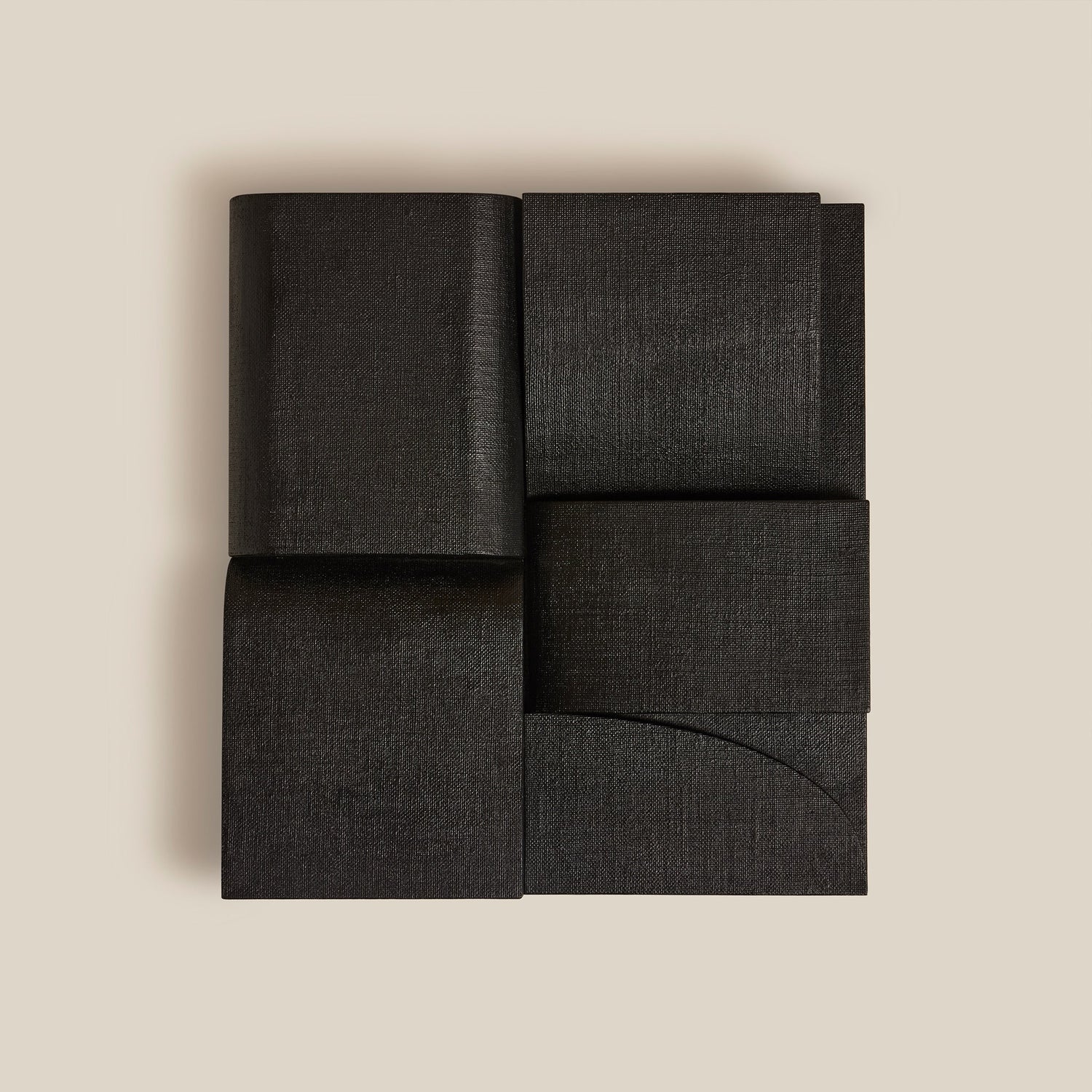 Black fabric wall art on a beige background- Number 1