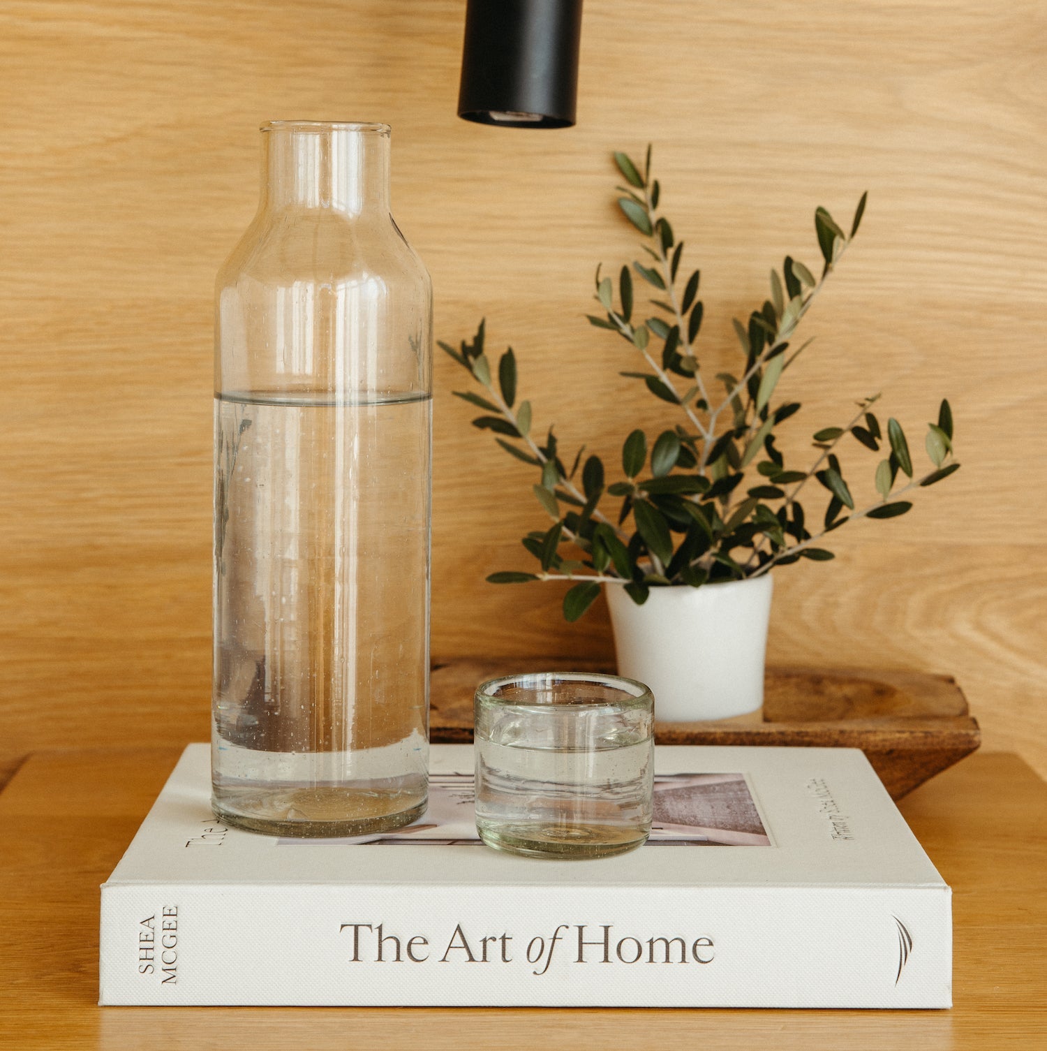 clear carafe and glass on top of a book- Number 2