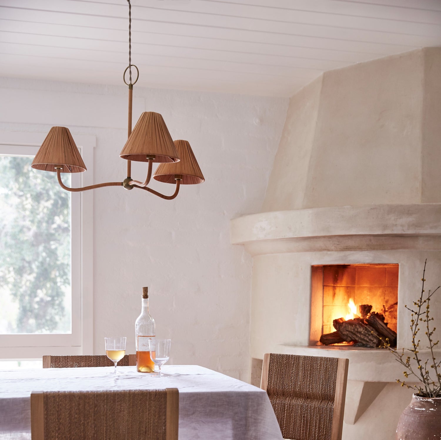 Brown chandelier over dining table next to fire place- Number 3
