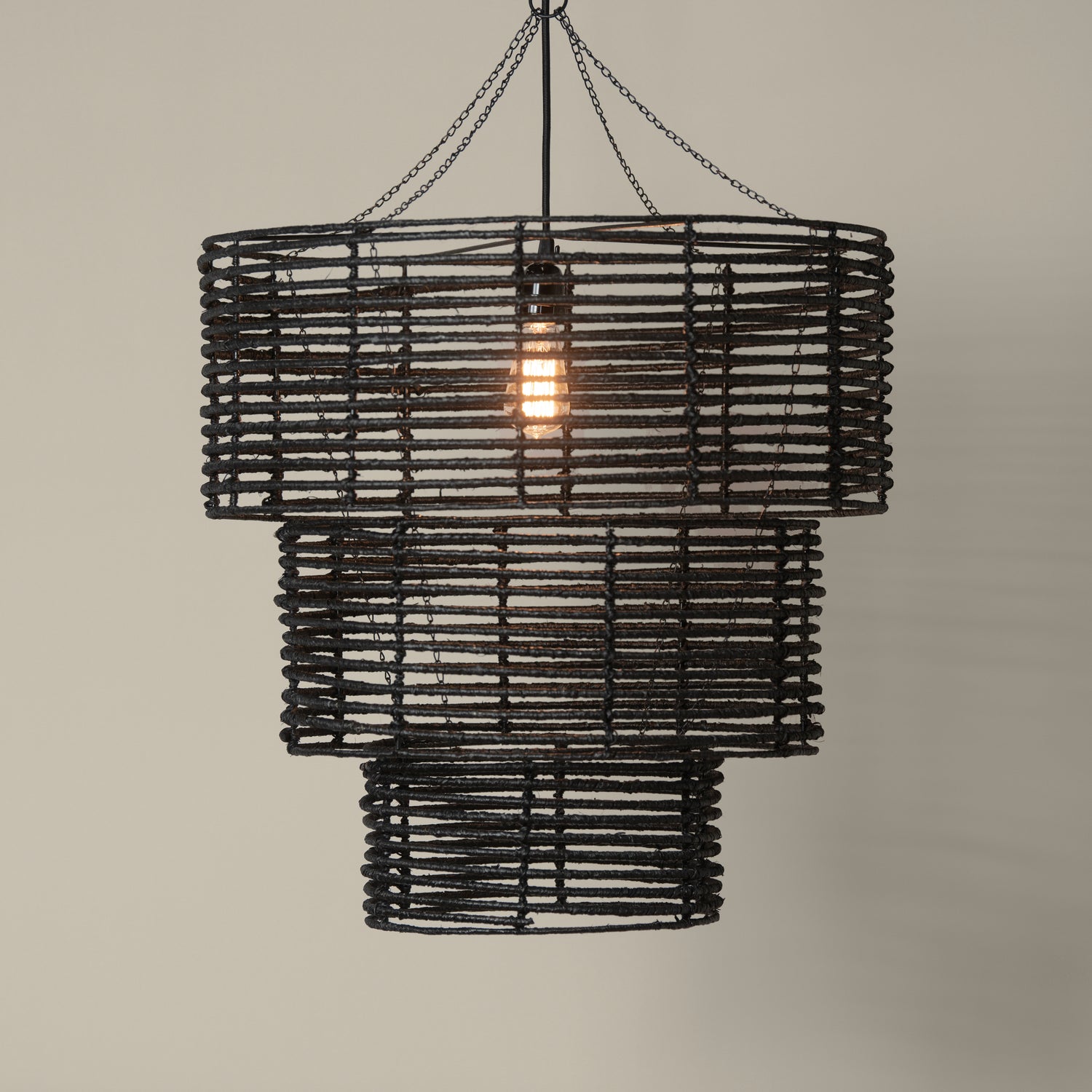 3 tier chandelier in black with light on