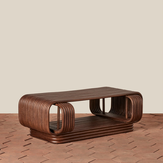 Wooden coffee table with a modern design on a wooden floor.