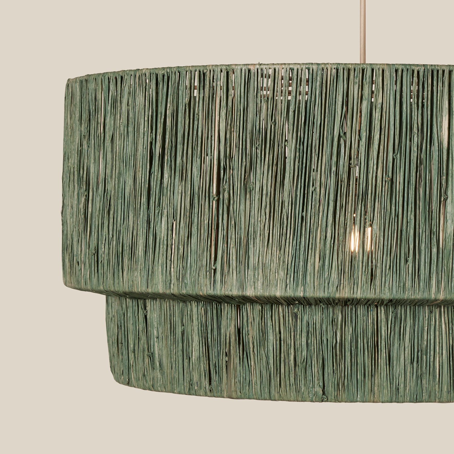 Textured green pendant light on a neutral background- Number 9
