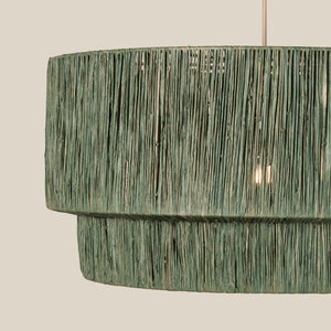 Textured green pendant light on a neutral background - Number 9