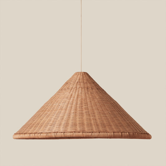 woven brown pendant hanging against neutral background