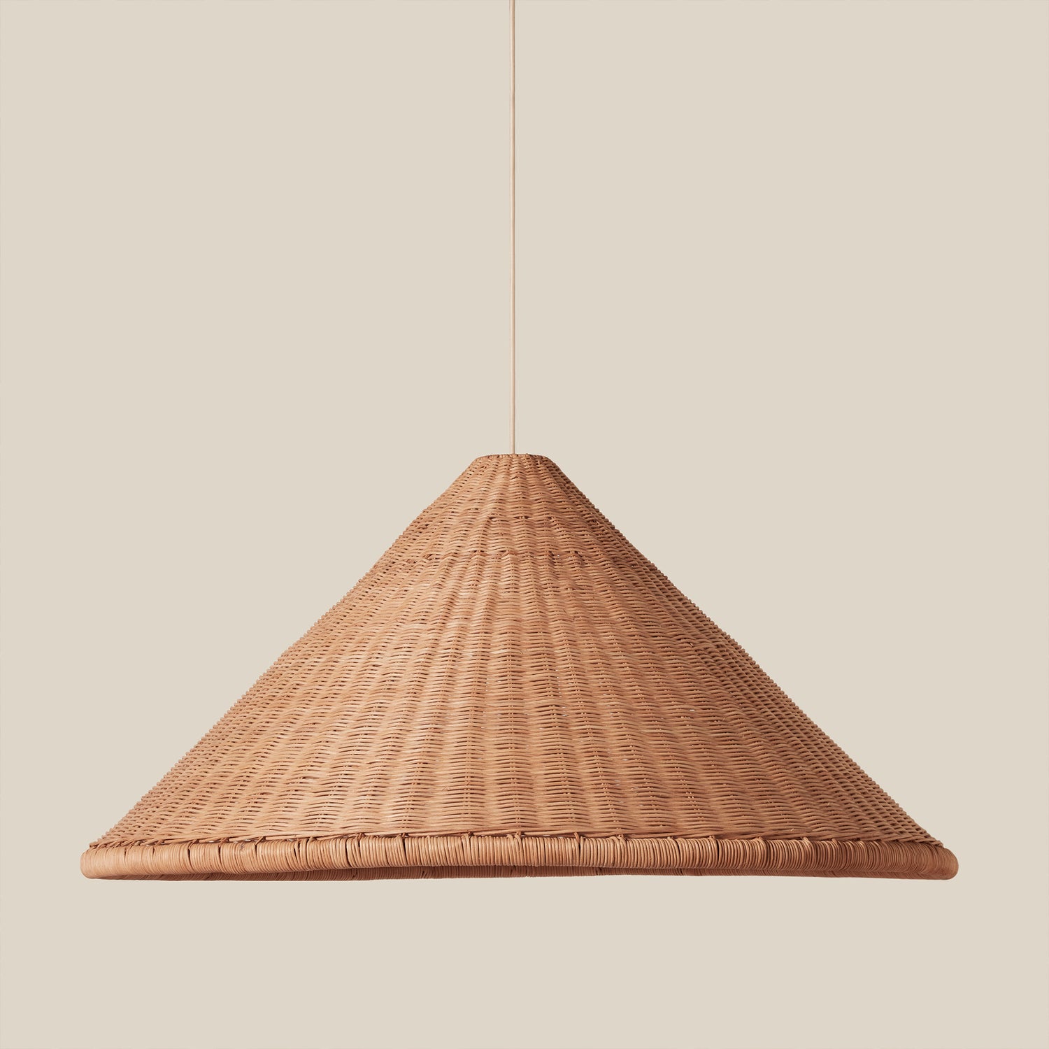 woven brown pendant hanging against neutral background- Number 1