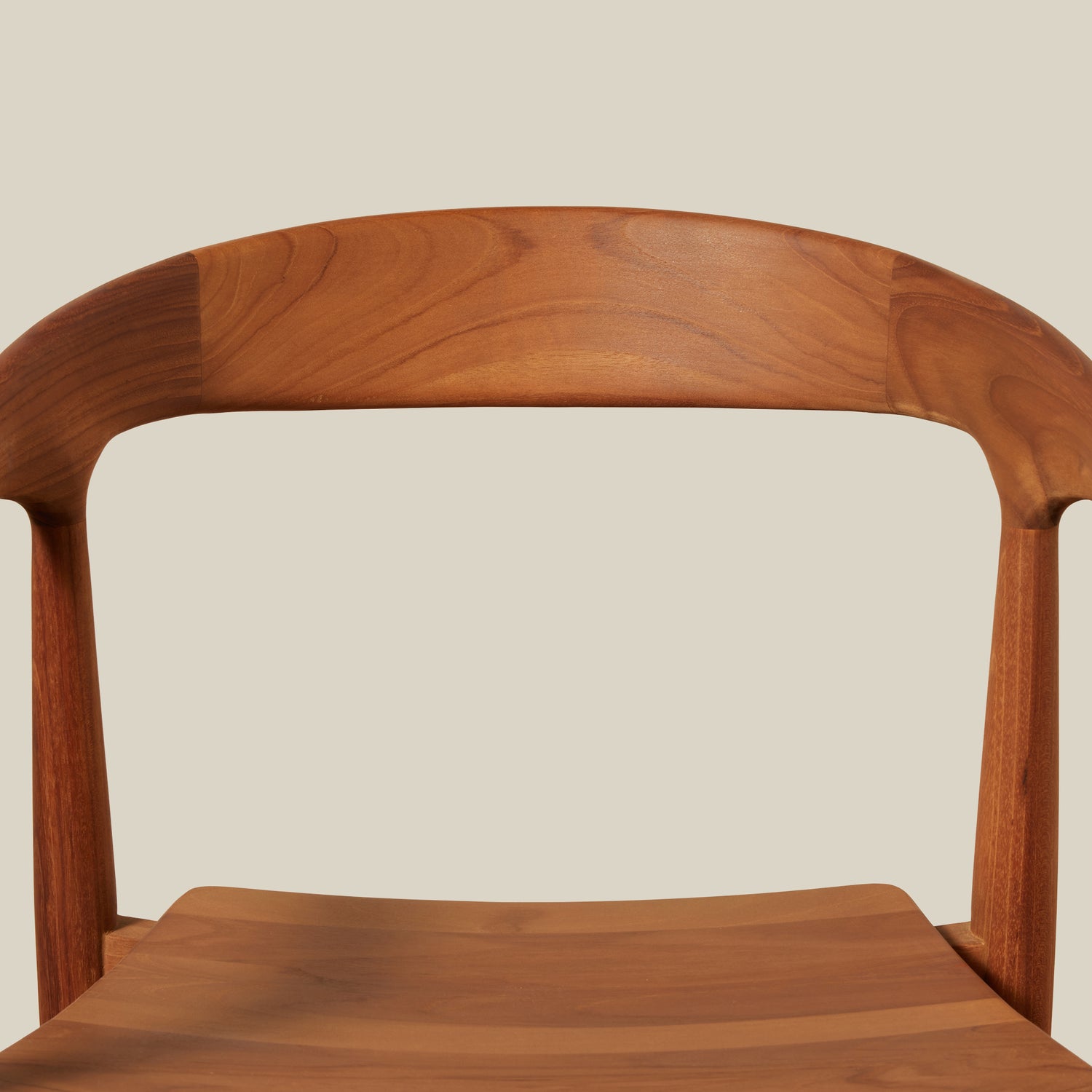 Wooden chair with a curved backrest on a beige background- Number 8